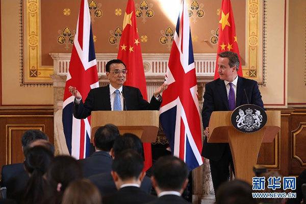 6月17日,國務院總理李克強同英國首相卡梅倫在倫敦舉行中英總理年度會晤后共同會見記者。 新華社記者 龐興雷 攝